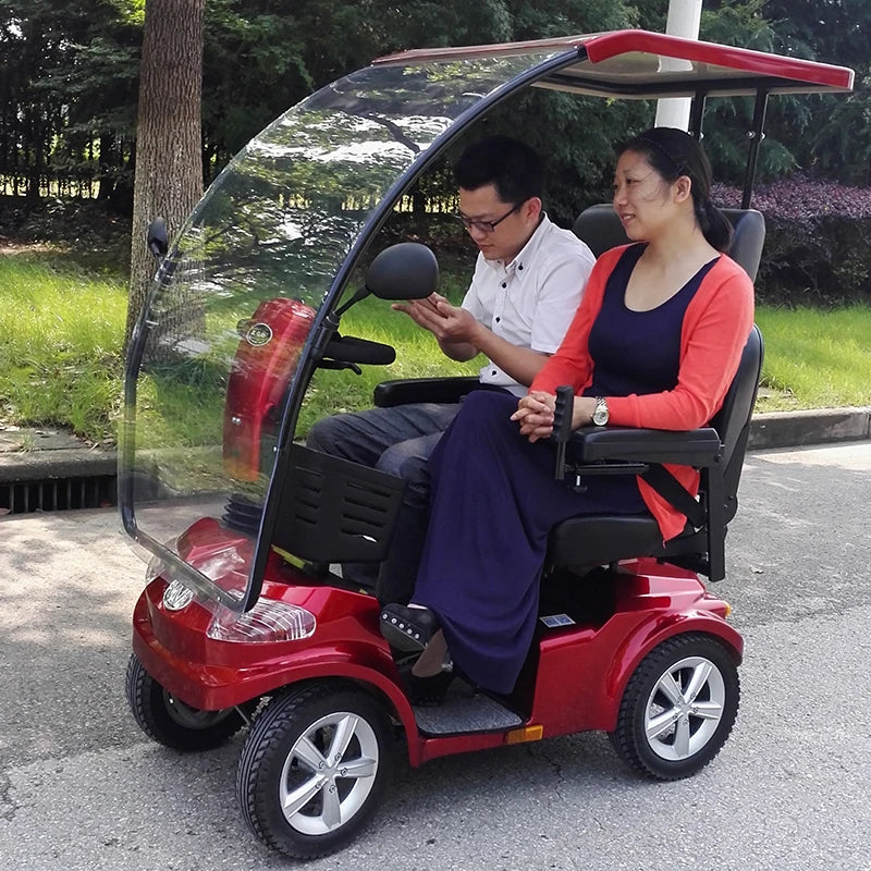 Elderly electric scooter with four wheels and two people can enter the elevator to pick up and drop off children. Disabled